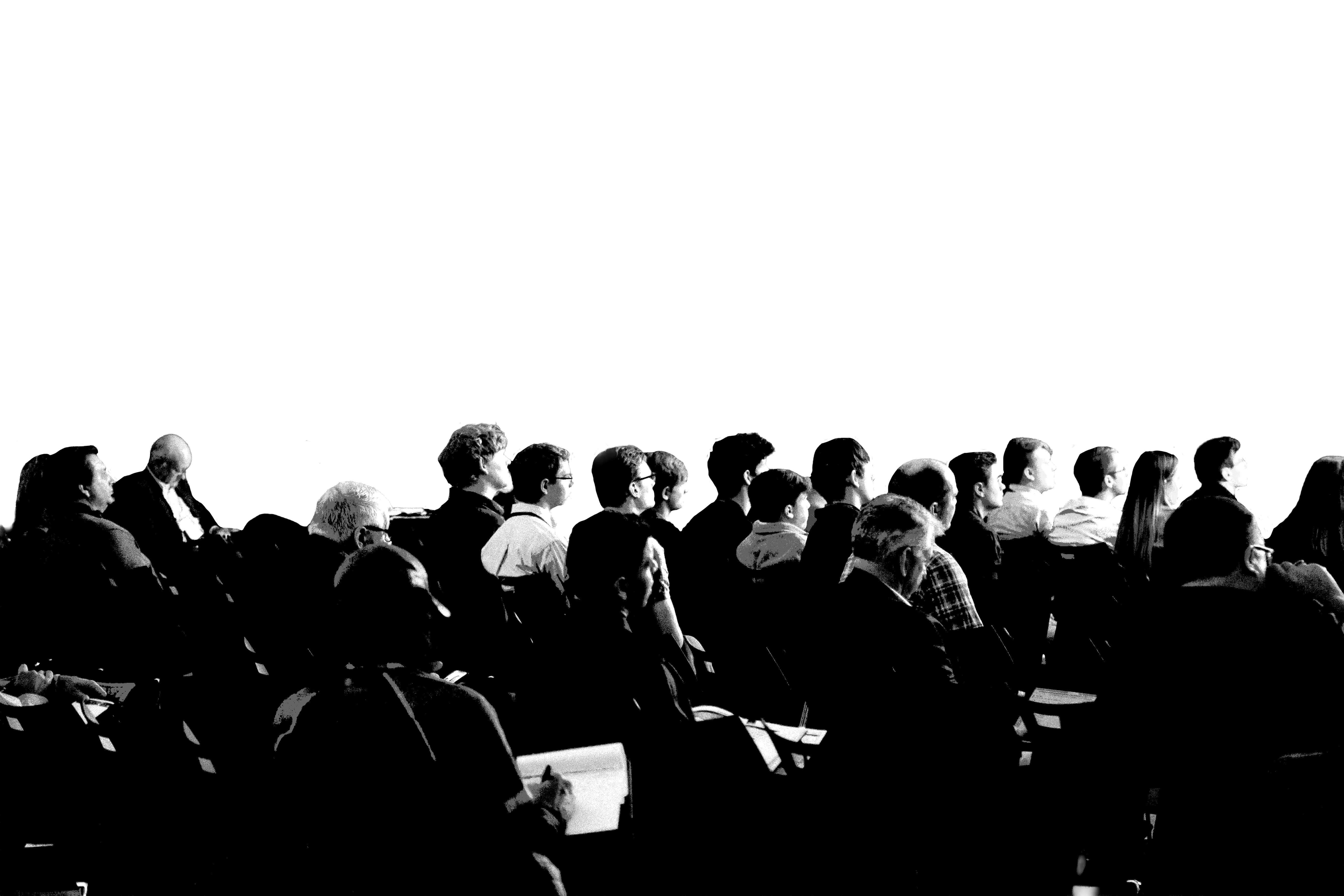 An audience watching a conference session